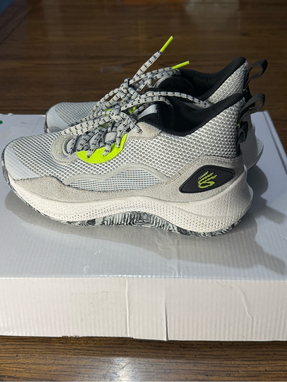 Under Armour Men’s Steph Curry Light Gray and Neon Yellow Athletic Sneakers